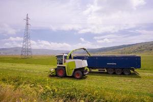 combine machine loading bunker of the truck photo