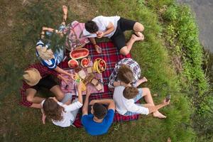 top view of group friends enjoying picnic time photo