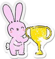 distressed sticker of a cute cartoon rabbit with sports trophy cup vector