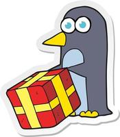 sticker of a cartoon penguin with christmas present vector