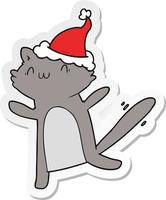 sticker cartoon of a dancing cat wearing santa hat vector