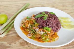 Salad mackerel in tomato sauce with cooked jasmine rice photo