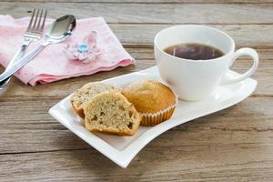 Banana cup cake with coffee cup photo