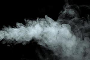 Abstract powder or smoke isolated on black background photo