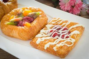 danish pastry with fruits on white dish photo