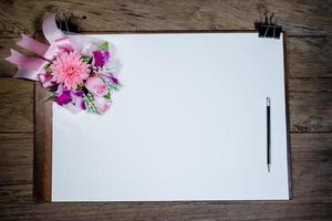 drawing board with paper on desk photo