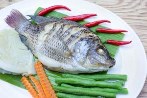 Steamed Nilotica fish,thai style steamed fish with vegetable photo