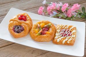 danish pastry with fruits on white dish photo