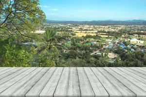 Empty wooden board space platform with top view of nan city at Khao Noi temple, Thailand photo