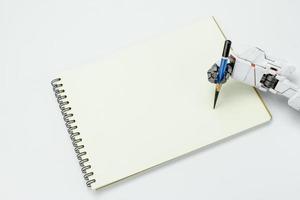 Hand robot hold a pencil writing on background photo