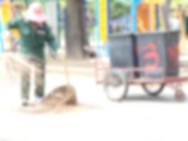Women sweep the streets in public park blur background of Illustration,Abstract Blurred photo