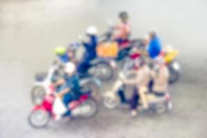 Abstract blur group motorcycle driving on road photo