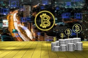 Digital money with bitcoin symbol and network connection concept with blurred cityscape background photo