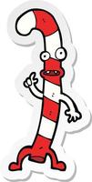 sticker of a cartoon dancing christmas candy cane vector