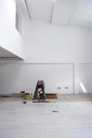 worker installing the ceramic wood effect tiles on the floor photo