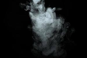 Abstract powder or smoke isolated on black background photo