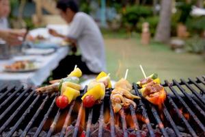 Dinner barbecue with roast seafood and pork photo