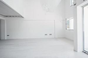 Interior of empty stylish modern open space two level apartment photo