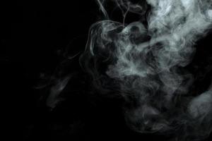 Abstract powder or smoke isolated on black background photo