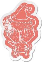 laughing polar bear cartoon distressed sticker of a wearing santa hat vector