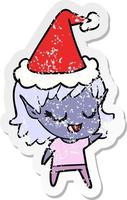 happy distressed sticker cartoon of a elf girl wearing santa hat vector