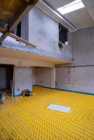 yellow underfloor heating installation with white pipes photo