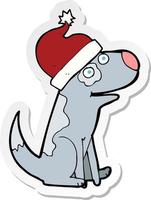 sticker of a cartoon dog wearing christmas hat vector