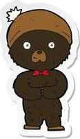 sticker of a cartoon little black bear vector
