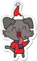 sticker cartoon of a panting dog wearing santa hat vector