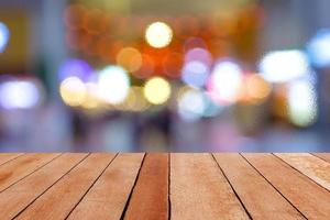 Wooden table with blur bokeh background photo