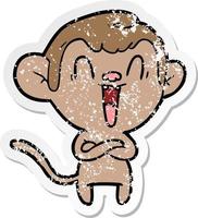 distressed sticker of a cartoon laughing monkey vector