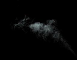 Abstract powder or smoke isolated on black background photo