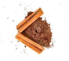 cinnamon powder and sticks isolated on a white background photo