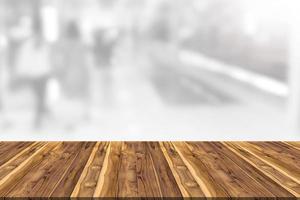 Empty wooden board space platform with shopping mall blurred background photo