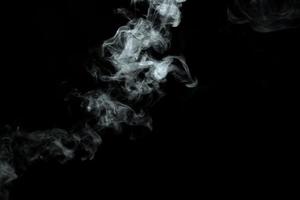 Abstract powder or smoke isolated on black background photo