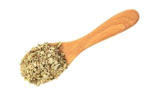Oregano in wooden spoon  isolated on white background photo