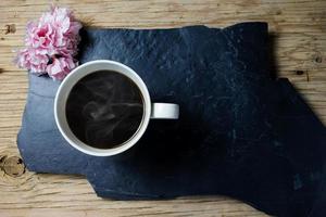 coffee and flower on wood background photo