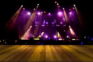 top desk with light bokeh in concert blur background,wooden table photo