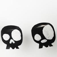 Bats and skulls black on white background, place to write greeting. photo