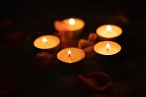 Rose petals and a set of scented candles, a romantic evening. photo