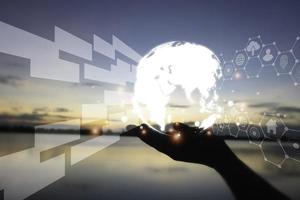Hand holding circle network communication technology for global.Data in the global computer social.telecommunication,earth cryptocurrency.photo modern technology and communication concept. photo
