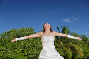 asian bride on beach photo