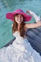 asian bride on beach photo