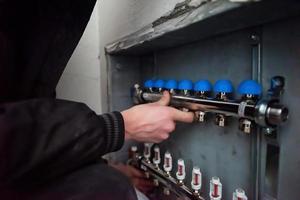 engineer checking technical data of heating system photo