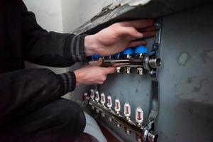 engineer checking technical data of heating system photo