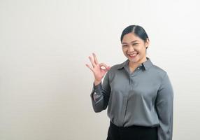 Asian woman with ok hand sign photo