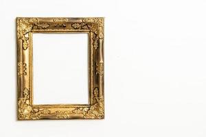 empty picture frame on white wall background photo