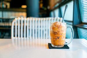 Thai tea ice scoop in glass photo