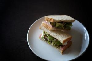 Sandwiches with egg, ham and toast cheese fried in white dish photo