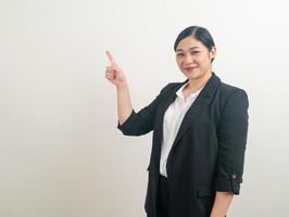 Asian woman with hand pointing on white background photo